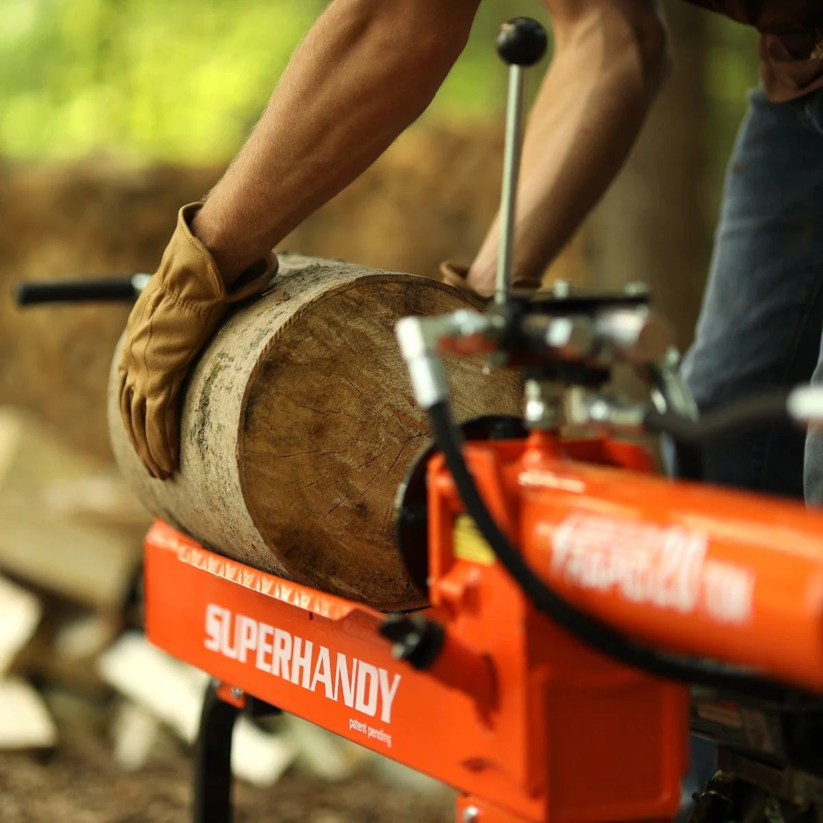 User operates the Super Handy | 20-Ton Gas Log Splitter, lifting a log for efficient wood splitting.
