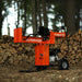 Super Handy | 25-Ton Gas Log Splitter standing on wood chips with split logs in the background, ideal for heavy-duty use.
